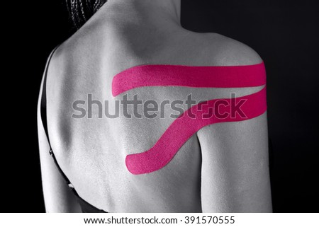 medical taping for releasing pain in shoulder