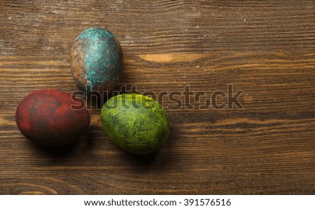 Easter eggs on a wooden table .Rustic style. Top view. Free space for text.