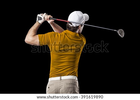 Golf Player in a orange shirt taking a swing, on a black Background.
