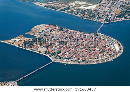 Aerial view of island-city of Aitoliko, inside the Aitoliko lagoon, Aetolia-Akarnania, Greece Royalty-Free Stock Photo #391683439