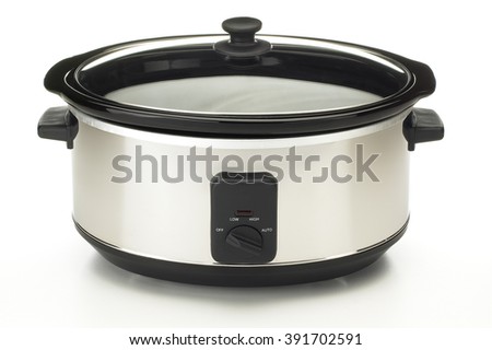 Closeup of electric crock pot on white background Royalty-Free Stock Photo #391702591