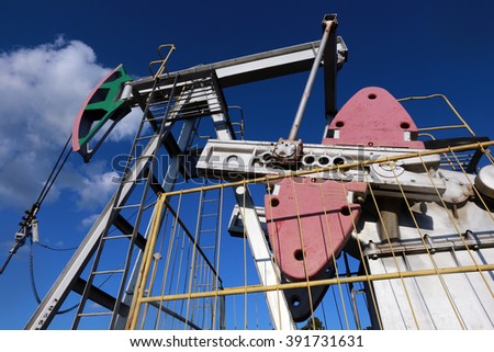 close-up on a background of blue sky fragment of the oil pump