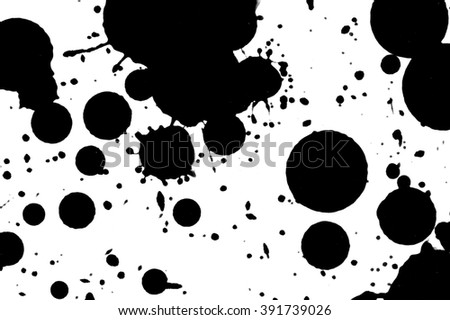 Ink droplets on paper background.