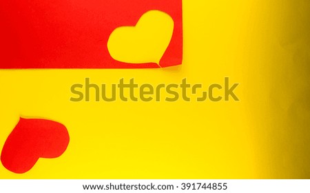 heart on yellow, red background