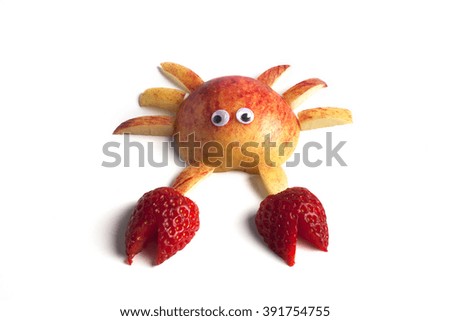 Food art creative concepts. Cute crab made of apples and strawberry isolated on white background.