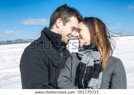 A Couple In winter Snow Scene at beautiful sunny day