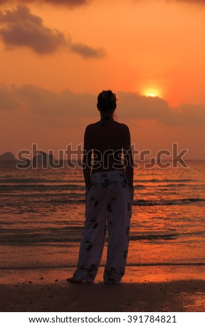 Girl on sunset background in Thailand Koh Samui island Thalin Ngam beach 