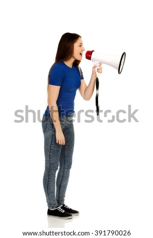 Screaming young woman with megaphone.