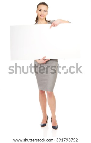 Business woman presenting empty banner.