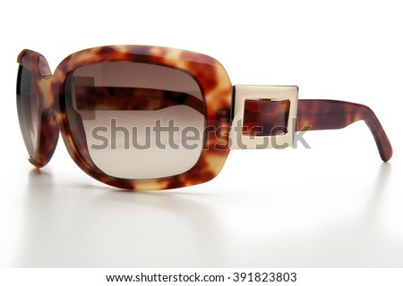 Closeup of stylish brown sunglasses isolated on white background