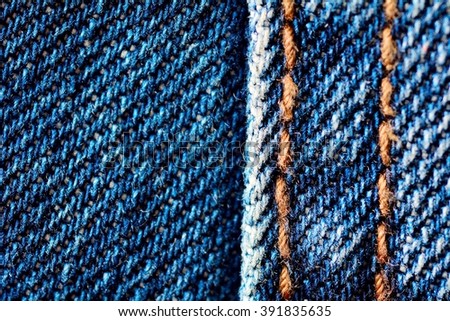 Blue jeans texture with seam.