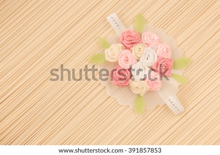 artificial flower on noodle  background