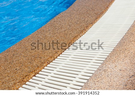 swimming pool edge with drainage ditch in Thailand
