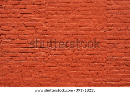 Bright vivid red plain painted brick wall texture surface.
