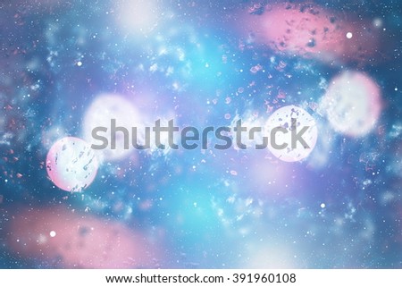 abstract blurred of blue and silver glittering shine bulbs lights background:blur of Christmas wallpaper decorations