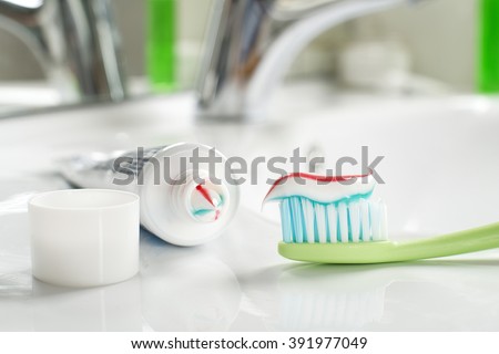 Toothbrushe and toothpaste in the bathroom close up. Royalty-Free Stock Photo #391977049