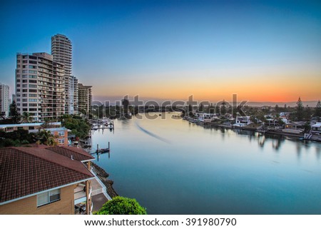 Long exposure of soft and colorful sunset on Nerang River, Gold Coast Australia Royalty-Free Stock Photo #391980790