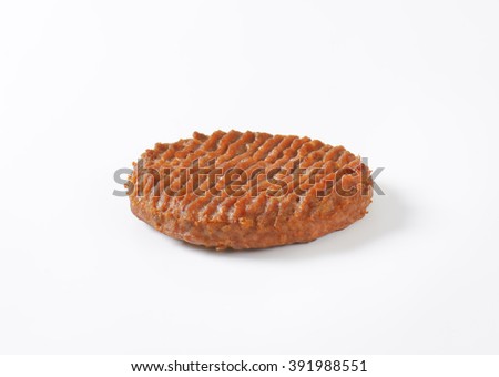 roasted hamburger patty on white background