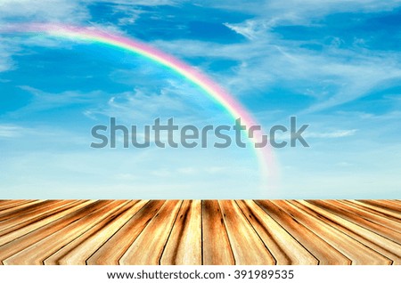 wood , perspective with rainbow sky