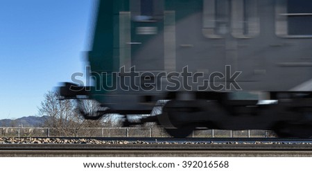 Photo blurred intentionally to show the motion of the train.