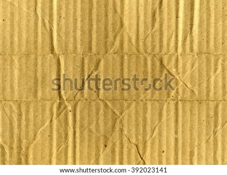 Crumpled kraft paper texture or brown wrinkled recycled cardboard sheet