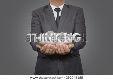 businessman holding with think big sign 3d,think big concept words 