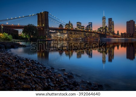 Brooklyn Bridge and Manhattan skyline in New York City over the East River at night