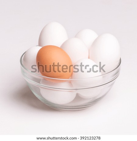 White chicken eggs in glass dish