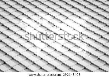 Tile roof of old Thai temple texture surface white color use for background with world map