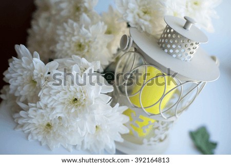 delicate decor of the candlestick and chrysanthemums
