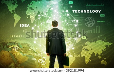 Businessman in front of holographic screen