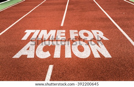 Time for Action written on running track Royalty-Free Stock Photo #392200645
