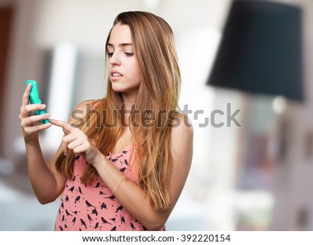 worried young woman using a calculator