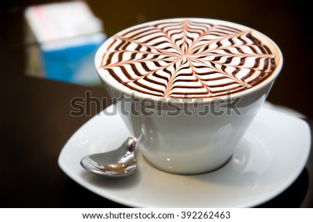 A Cup of coffee with a pattern 