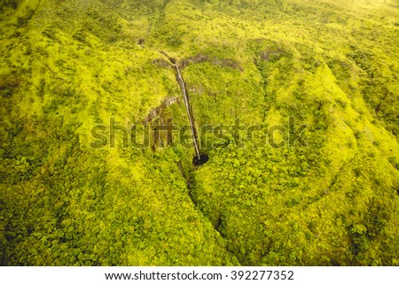 Waterfalls in Maui Hawaii. Breath taking dramatic waterfall in Maui, Hawaii national park. Dramatic landscape yellow green tropical rain-forest of Maui, Hawaii. Waimoku falls arial view.