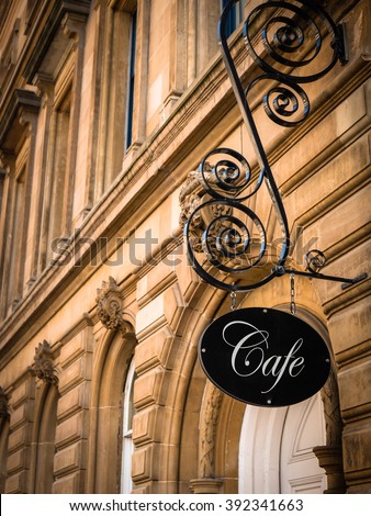 Ornate Sign For An Exclusive Cafe In A European City