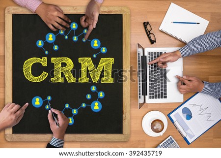 Business Customer CRM Management Analysis Service Concept Businessman working at office desk and using computer and objects on the right, coffee,  top view