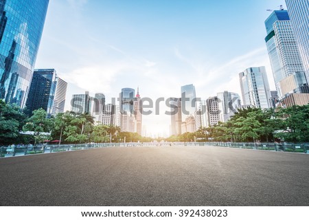empty asphalt road and modern buildings in guangzhou Royalty-Free Stock Photo #392438023
