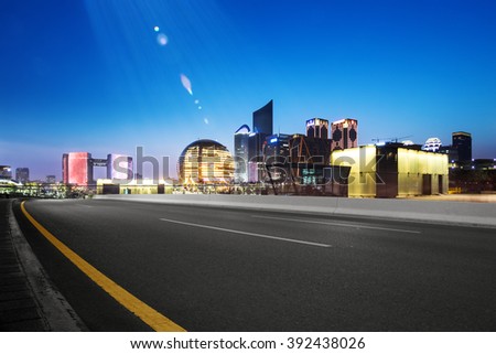 empty asphalt road with cityscape and skyline of hangzhou