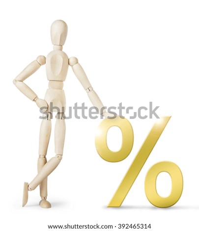 Man leaned against a large golden percent sign. Abstract image with a wooden puppet
