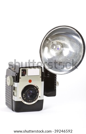 Old retro camera with flash isolated on white.