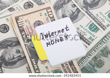 Concept write - Internet Money. Sign lays on money background
