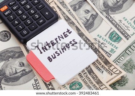Concept write - On Line Business. Sign lays with calculator