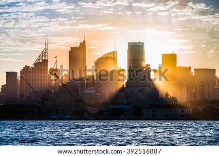 Sun rays shining through the skyline of Sydney.