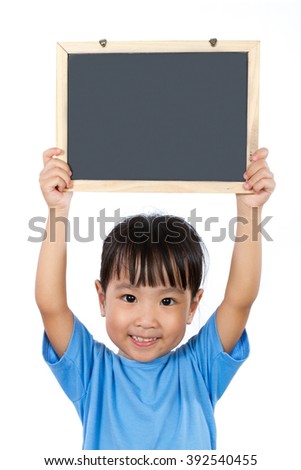 Asian Little Chinese Girl Holding a Blackboard isolated on White Background