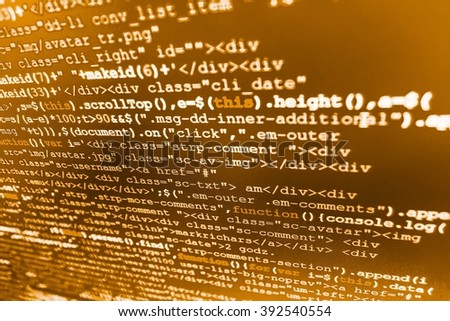 Developer working on software codes in office.  Website codes on computer monitor. Programming code on computer screen.  Abstract screen of software. Software source code. 
