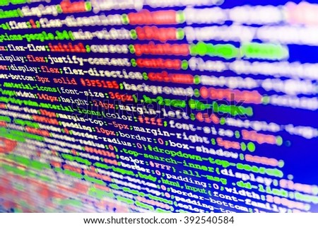 Website programming code. Source code photo. Writing program code on computer.  Web site codes on computer monitor. Software source code. Developer working on websites codes in office. 

