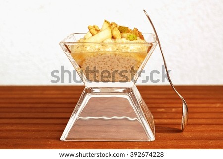 Porridge with pear and walnuts, front horizontal view