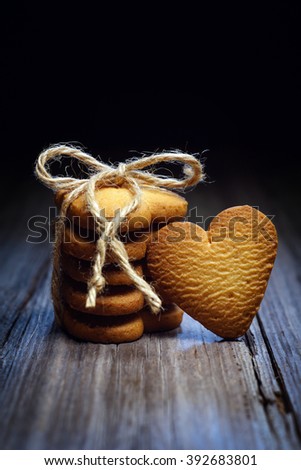  cookies in the shape of a heart on a dark background 