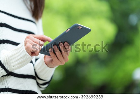 Woman touch on the screen of cellphone